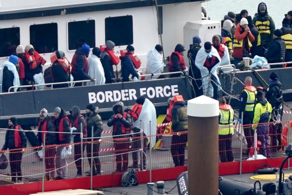 A group of people thought to be migrants are brought in to Dover, Kent, onboard a Border Force vessel <i>(Image: Gareth Fuller/PA Wire)</i>