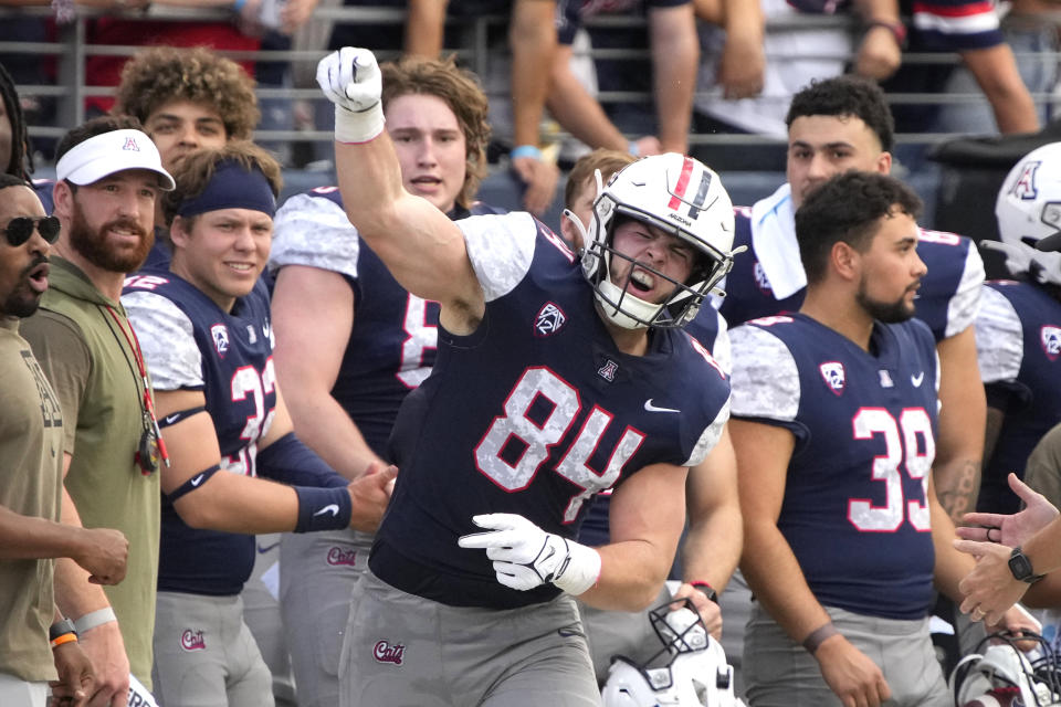 Arizona tight end Tanner McLachlan (84) reacts after making a play against Utah during the first half of an NCAA college football game, Saturday, Nov. 18, 2023, in Tucson, Ariz. (AP Photo/Rick Scuteri)