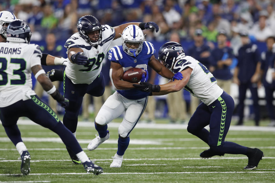 Indianapolis Colts running back Jonathan Taylor (28) runs the ball against the Seattle Seahawks during an NFL football game in Indianapolis, Sunday, Sept. 12, 2021. (Jeff Haynes/AP Images for Panini)