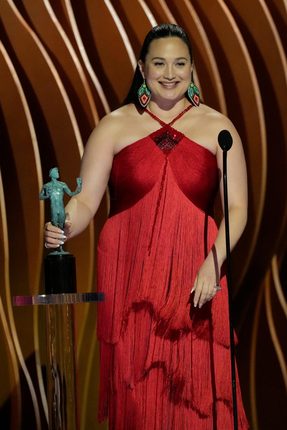 Lily Gladstone accepts the award for outstanding performance by a female actor in a leading role during the Screen Actors Guild Awards on Saturday, Feb. 24, 2024 at The Shrine Auditorium and Expo Hall in Los Angeles.