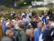 Dustin Johnson of the U.S.watches his tee shot on the fourth hole during the final round of the British Open golf championship on the Old Course in St. Andrews, Scotland, July 20, 2015. REUTERS/Lee Smith