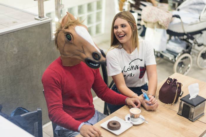 person wearing a horse mask on a date