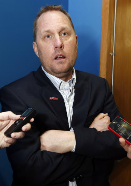 Mississippi football coach Hugh Freeze discusses his new contract with the media prior to the Conerly Trophy awards ceremony on Tuesday, Dec. 2, 2014, in Jackson, Miss. (AP Photo/Rogelio V. Solis)