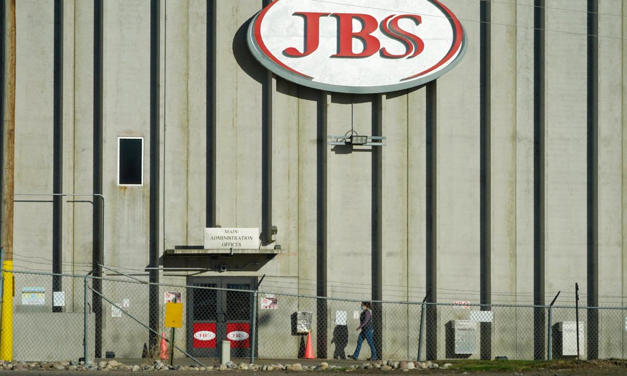 <span>A worker heads into the JBS meatpacking plant in Greeley, Colorado, on 12 October 2020.</span><span>Photograph: David Zalubowski/AP</span>