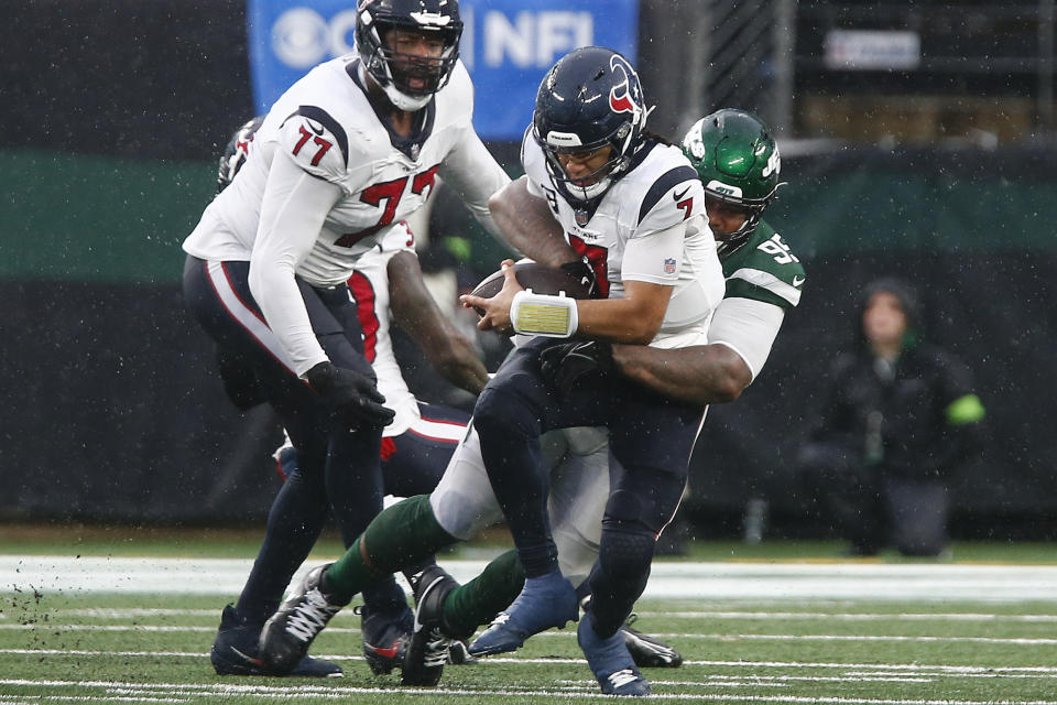New York Jets defensive tackle Quinnen Williams (95) sacks Houston Texans quarterback C.J. Stroud (7) during the fourth quarter of an NFL football game, Sunday, Dec. 10, 2023, in East Rutherford, N.J. (AP Photo/John Munson)