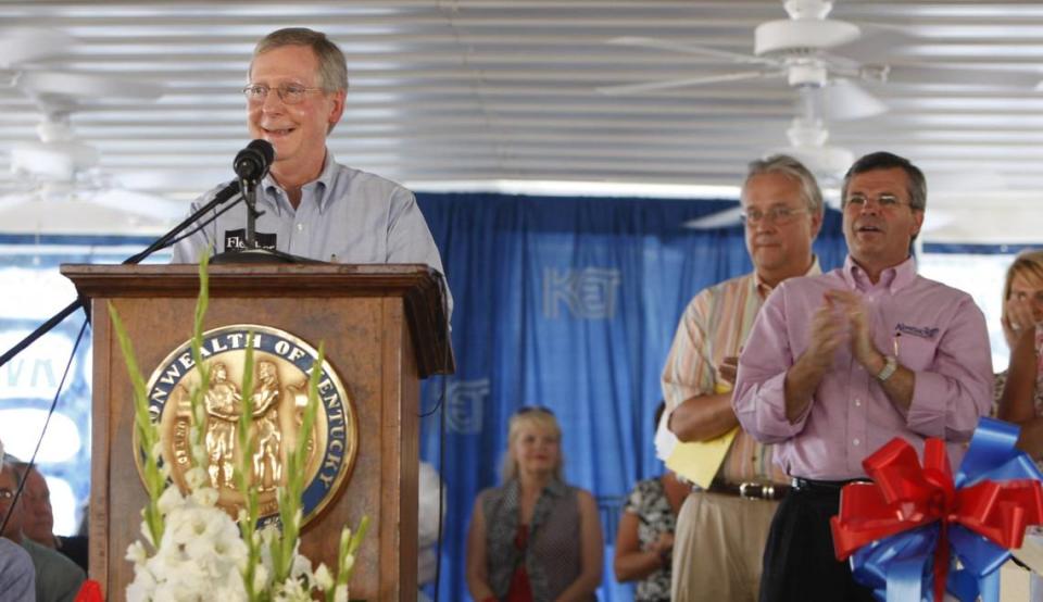 U.S. Senator Mitch McConnell, left, spoke as Ky Senate President David Williams, and Ky Gov. Ernie Fletcher, right, applauded at the annual Fancy Farm political picnic held at the St. Jerome Catholic Church in Fancy Farm, Ky., Saturday, August 4, 2007. Photo by Charles Bertram | Staff. 3699