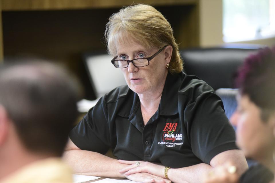 Rebecca Owens, director of the Richland County Emergency Management Agency, listens Wednesday as community leaders discuss disaster preparedness in advance of the total solar eclipse that will cover North Central Ohio on Monday, April 8, 2024.