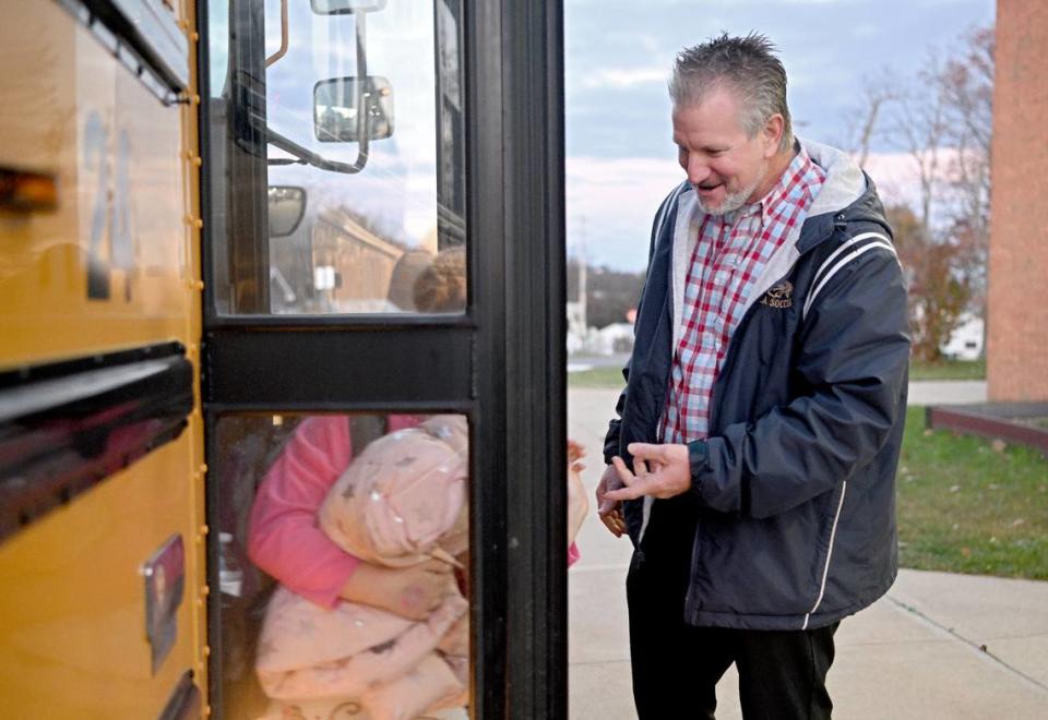 Head teacher Jason Bair greets students as they get off the bus at Mountaintop Elementary on Thursday, Nov. 2, 2023.