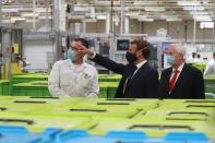 French President Emmanuel Macron visits a factory of manufacturer Valeo, in Etaples