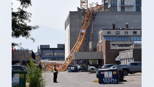 Five people were killed when a crane being used to build a residential tower in downtown Kelowna, B.C. collapsed on July 12, 2021. The RCMP are recommending a charge of criminal negligence causing death. (Alistair Waters/The Canadian Press - image credit)