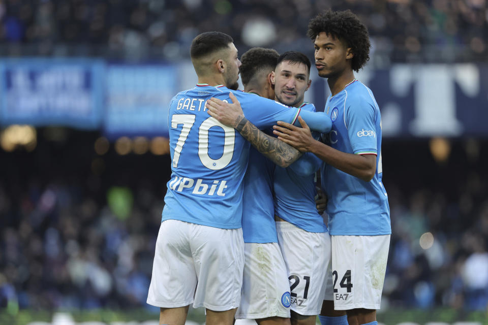 Napoli's Matteo Politano celebrates with teammates after scoring a goal, during the Italian Serie A soccer match between Napoli and Salernitana, at the Diego Armando Maradona stadium, in Naples, Italy, Saturday, Jan. 13, 2024. (Alessandro Garofalo/LaPresse via AP)