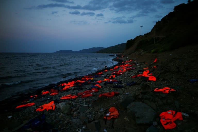 This photo taken on September 8, 2015 on the Greek island of Lesbos shows life vests left on the shore by incoming refugees