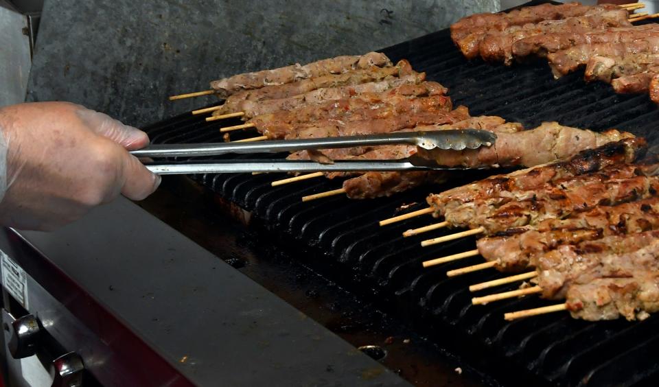 Food being grilled at a Greek Festival.