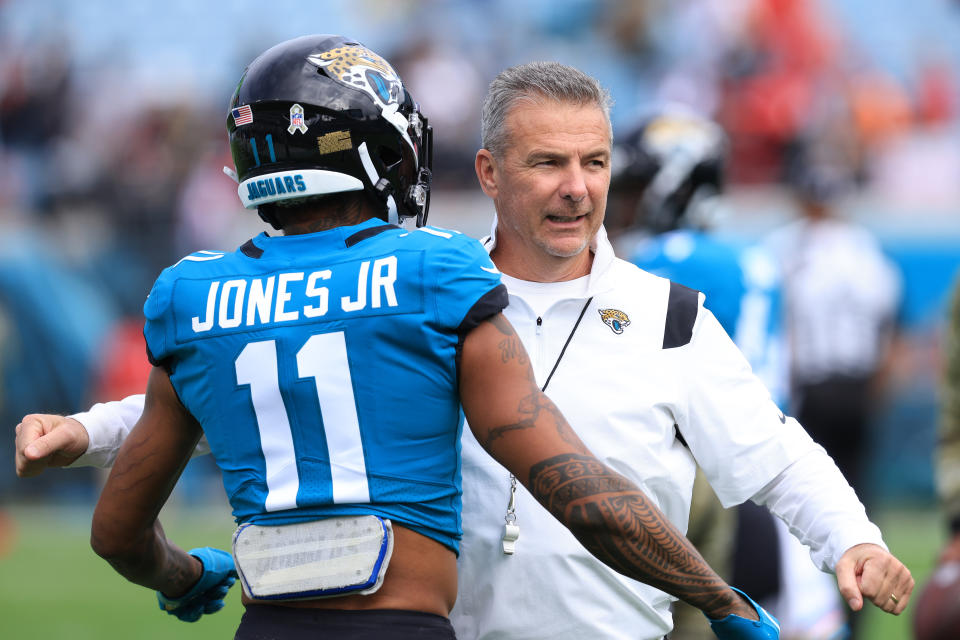 JA Head coach Urban Meyer and Marvin Jones Jr. #11 of the Jacksonville Jaguars hug during warm-up before the game against the Atlanta Falcons at TIAA Bank Field on November 28, 2021 in Jacksonville, Florida. (Photo by Sam Greenwood/Getty Images)