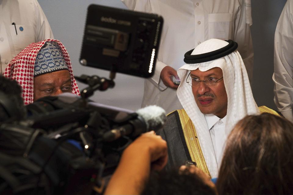 Saudi Energy Minister Prince Abdulaziz bin Salman speaks to journalists after a news conference that followed an OPEC meeting in Abu Dhabi, United Arab Emirates, Thursday, Sept. 12, 2019. OPEC's Joint Ministerial Monitoring Committee met Thursday in Abu Dhabi as estimates of lowered crude oil demand in 2020 have the cartel considering additional production cuts. Before the meeting started, Prince Abdulaziz again called for "cohesiveness" in OPEC. (AP Photo/Jon Gambrell)