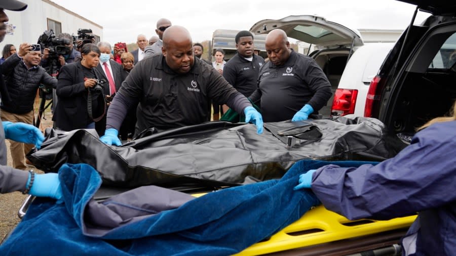 Westhaven Memorial Funeral Home staff adjust the body bag with the remains of Dexter Wade, a 37-year-old man who died after being hit by a Jackson, Mississippi police SUV driven by an off-duty officer, and who was buried in a pauper’s cemetery near the Hinds County Penal Farm in Raymond, Mississippi. (Photo: Rogelio V. Solis/AP)
