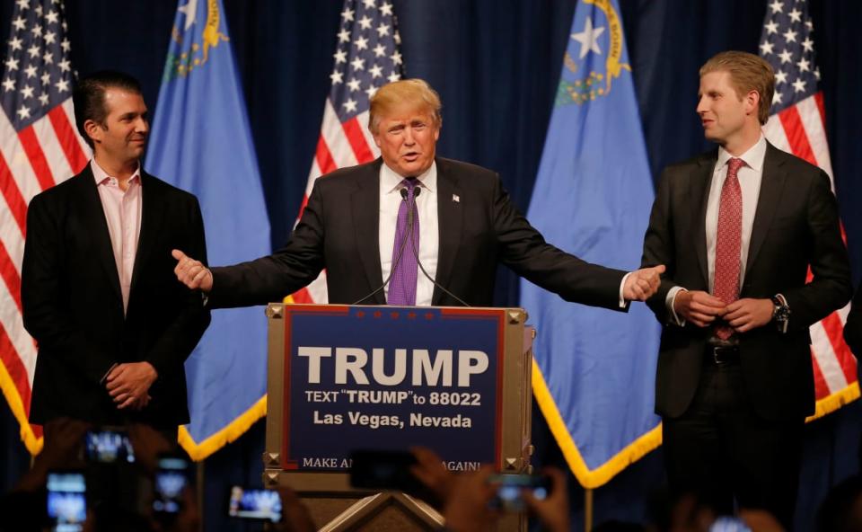 Donald Trump Jr., Donald Trump, and Eric Trump at a rally in Nevada