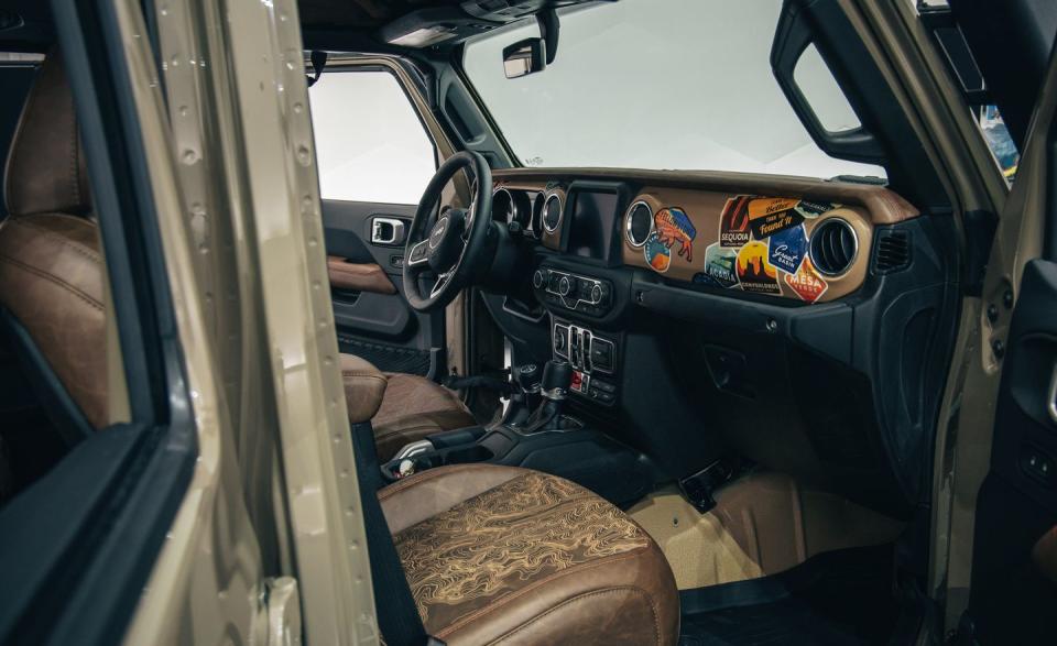 <p>Inside, the seats are brown leather and feature stitched topographical maps. </p>