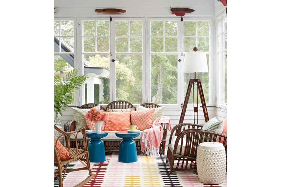 <p>Rylee, along with builder Steve Murphy, went to work infusing the New England classic with fresh style and function for the young family. "We preserved the historic details," says Murphy, who kept the cottage's original flooring, windows, doors, and woodwork, blending architectural salvage and carefully reproduced millwork where needed.</p> <p>And while the team wanted the home to serve the present-day needs of a busy family, "we didn't want it to feel slick and suburban," Rylee says. Allowing the floors to remain uneven and quirky, she says, was one way to keep the home grounded in its history.</p> <p>Pictured: On the screened porch, vintage wicker furnishings evoke the past. Half-hull boat models—hung as a dimensional border near the ceiling—lend nautical New England charm.</p>