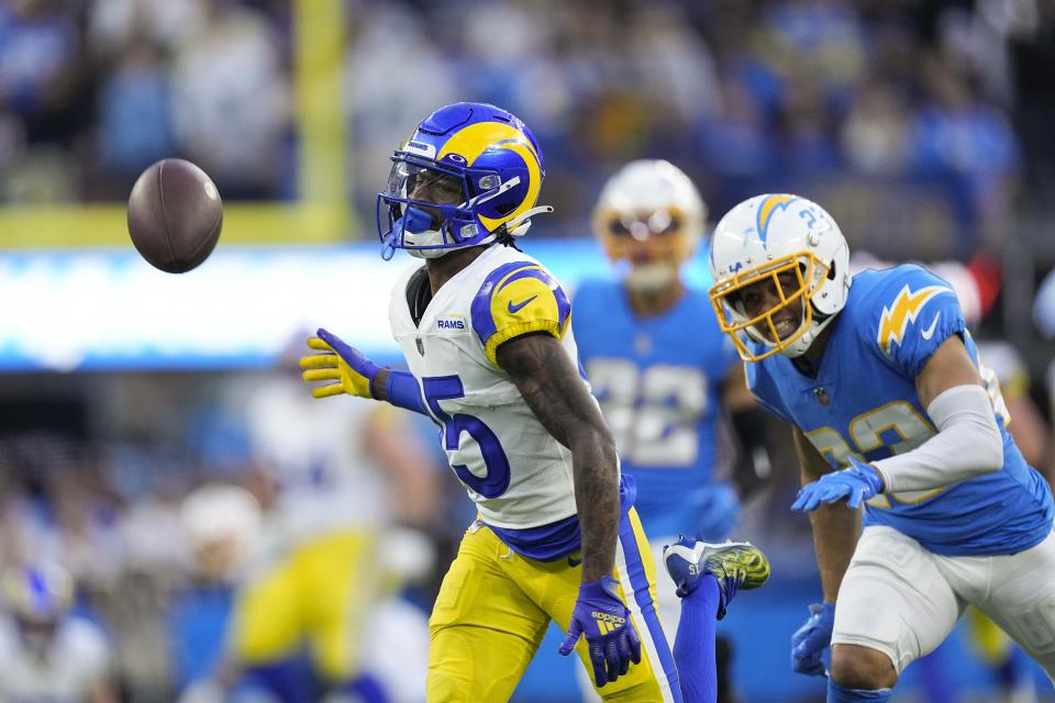 Los Angeles Rams cornerback Jalen Ramsey (5) can't catch a pass as he is pressured by Los Angeles Chargers cornerback Bryce Callahan (23) during the second half of an NFL football game Sunday, Jan. 1, 2023, in Inglewood, Calif. (AP Photo/Mark J. Terrill)