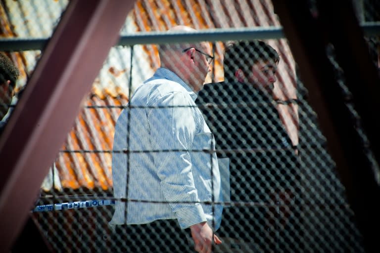 Investigators examine the accident site at the Dreamworld theme park in Australia's Gold Coast, on October 26, 2016