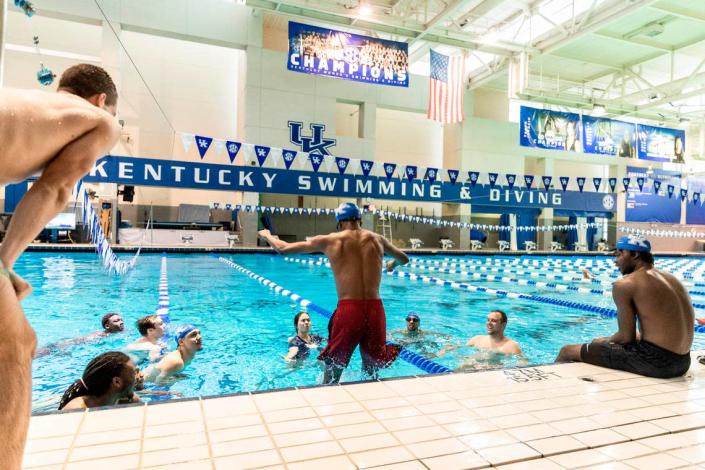Daimion Collins jumps in the pool during the Kentucky basketball team’s swimming lessons last month.