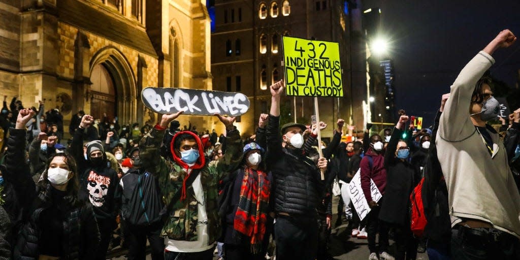 Protestors at a Black Lives Matter protest on the steps of St Paul Cathedral in Melbourne, Australia, on June 06, 2020.