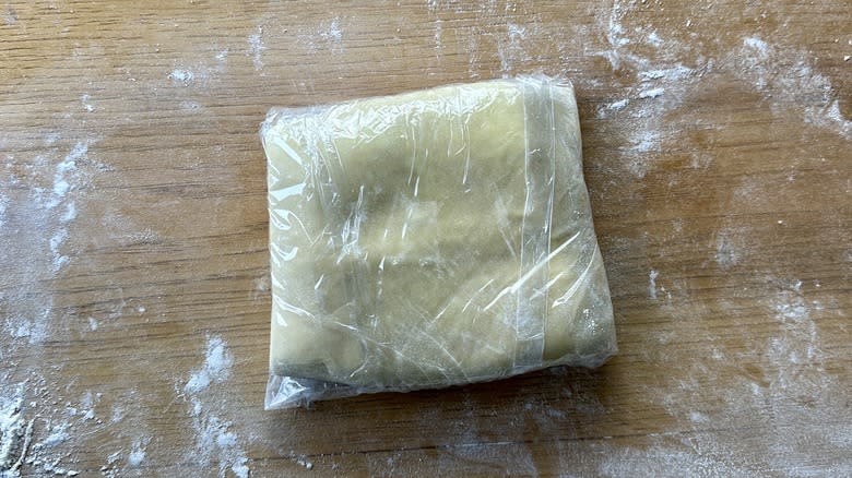 plastic wrapped dough square