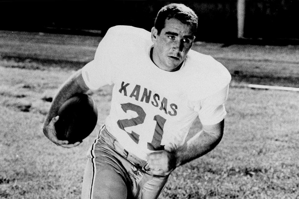 FILE - University of Kansas quarterback John Hadl is shown during a workout, Dec. 7, 1960. Longtime NFL quarterback John Hadl, who starred for his hometown Kansas Jayhawks before embarking on a professional career that included six Pro Bowl appearances and an All-Pro nod, died Wednesday, Nov. 30, 2022. He was 82. The university, where Hadl returned after his playing days as a coach and fundraiser, announced his death at the wishes of his family in a statement. No cause was given. (AP Photo/File)
