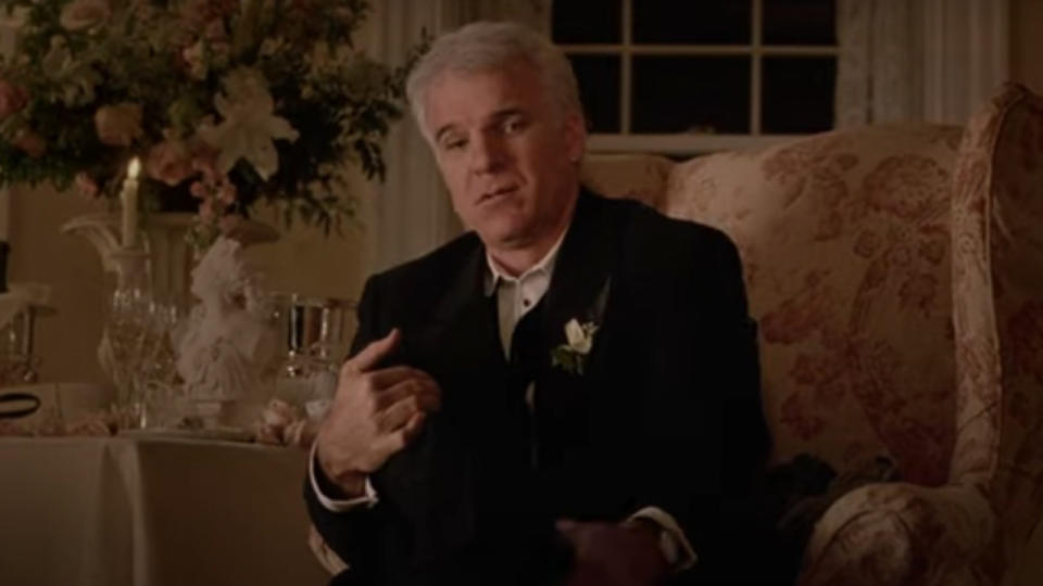 Steve sitting down in a nice suit in Father of the Bride