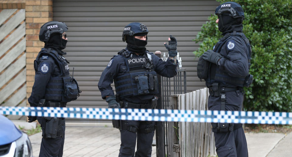 Police are seen outside one of the houses involved in counter terrorism raids across the north-western suburbs in Melbourne. Source: AAP