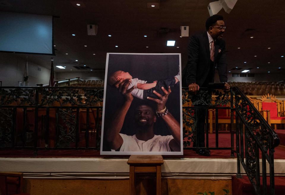 A poster of Tyre Nichols holding his daughter is displayed during a news conference at Mason Temple: Church of God in Christ World Headquarters in Memphis, Tennessee, on January 31, 2023.