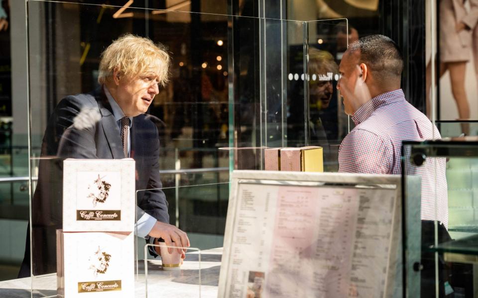 The Prime Minister visits a reopened coffee shop in Watford - AFP/John Nguyen