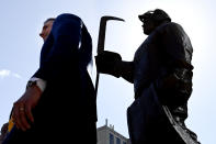 Former Nashville Predators goaltender Pekka Rinne, left, stands in front of his statue during an unveiling ceremony before an NHL hockey game between the Nashville Predators and the Seattle Kraken, Saturday, March 25, 2023, in Nashville, Tenn. (AP Photo/Mark Zaleski)