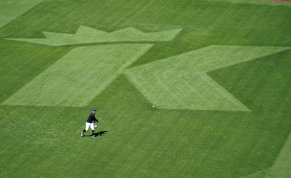 Seattle Mariners second baseman Jose Caballero warms up on the field next to a large "K" cut in the grass in honor of Felix Hernandez before a baseball game between the Mariners and the Baltimore Orioles, Friday, Aug. 11, 2023, in Seattle. Hernandez will be inducted into the Mariners Hall of Fame on Aug. 12. (AP Photo/Lindsey Wasson)