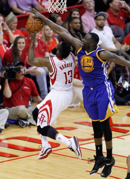 HOUSTON, TX - MAY 25: James Harden #13 of the Houston Rockets has his layup attempt blocked by Draymond Green #23 of the Golden State Warriors during Game Four of the Western Conference Finals at Toyota Center on May 25, 2015 in Houston, Texas. NOTE TO USER: User expressly acknowledges and agrees that, by dowloading and/or using this photograph, user is consenting to the terms and conditions of the Getty Images License Agreement. (Photo by Bob Levey/Getty Images)