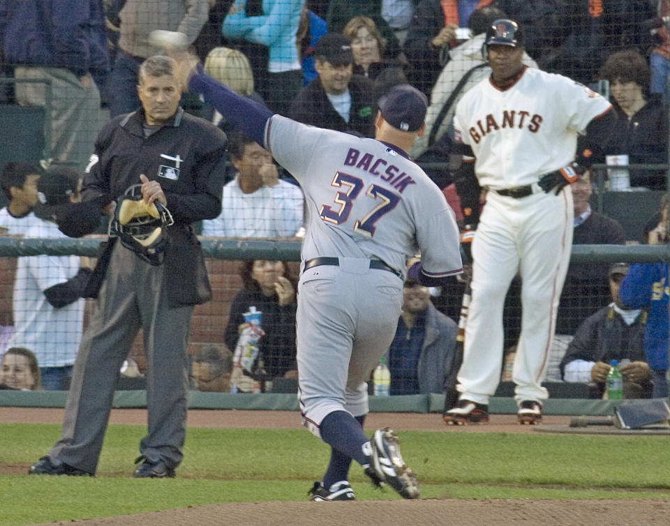 Nationals reliever Mike Bacsik gets ready to face Barry Bonds. (AP Photo)