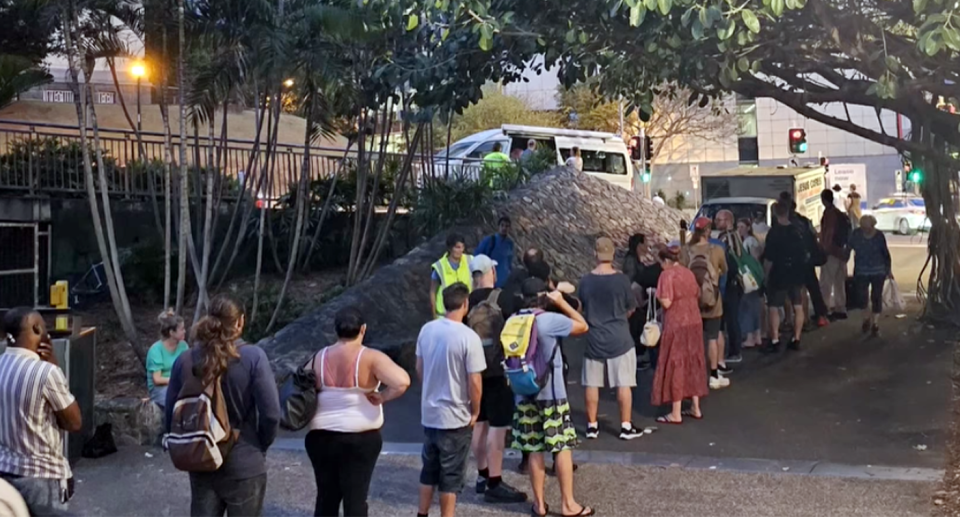 Queues for Paul Slater's charity service Northwest Community Group in Brisbane. 