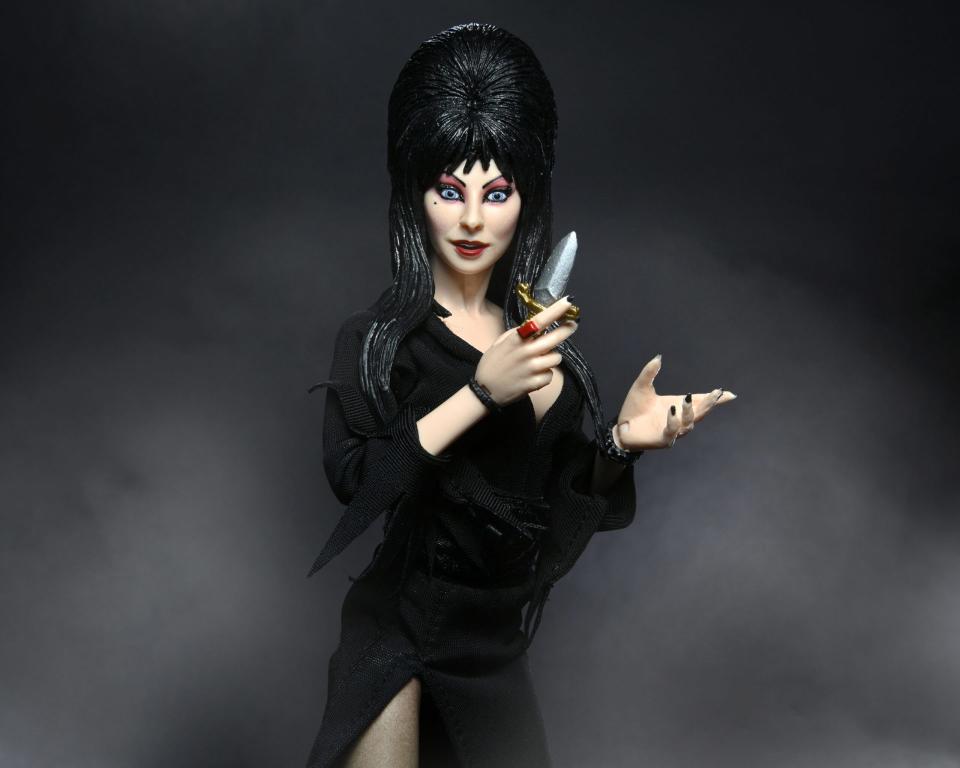 Elvira 8" action figure holding her dagger.