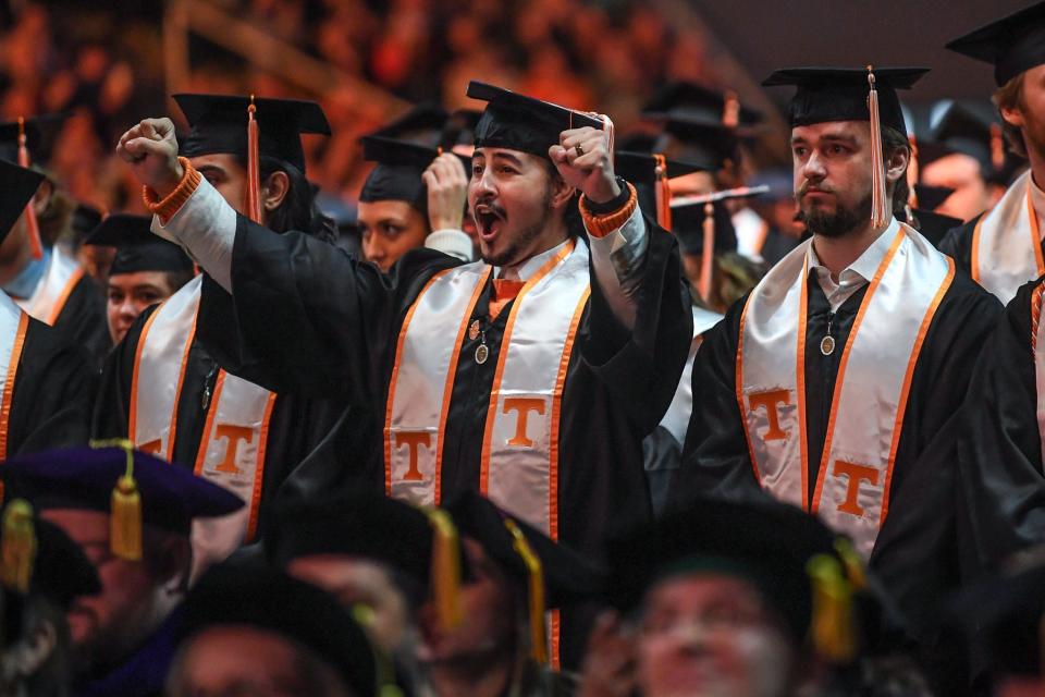 A University of Tennessee at Knoxville graduate cheers after receiving his diploma during the undergraduate commencement ceremony at Thompson-Boling Arena at Food City Center on Dec. 15. Graduation ceremonies are happening again May 16-19, and the university has dedicated three parking areas to graduates and guests.