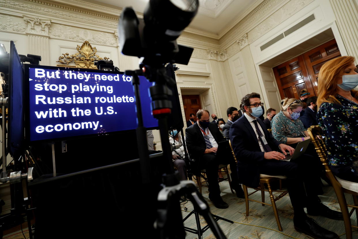 U.S. President Joe Biden's remarks scroll on a teleprompter as he speaks about the U.S. debt ceiling from the State Dining Room at the White House in Washington, U.S. October 4, 2021.  REUTERS/Jonathan Ernst