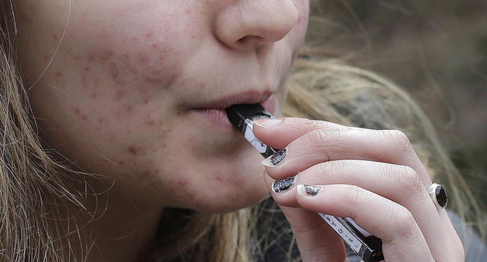 A woman vaping 