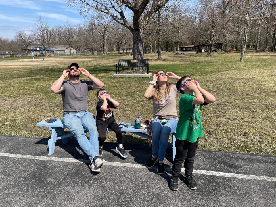Brian and Rachelle Thomas, of Windber, brought their sons Brailen Thomas, center, and Braiden Thomas, at right, to the park to watch the solar eclipse. Braiden was learning about the eclipse in school, and Brailen likes to learn about space, so the parents made plans to share the unique experience with their kids.