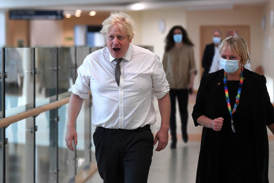 Britain's Prime Minister Boris Johnson (L) speaks with Marion Dickson, Executive Director of Nursing, Midwifery and Allied Health Professionals, and Executive Director for Surgery and Community Services for Northumbria Healthcare during a visit to Hexham General Hospital on November 8, 2021 in Hexham in northern England. - Prime Minister Boris Johnson faced pressure to appear before British lawmakers debating the standards system Monday, as days of sleaze and cronyism claims against his government intensified with new revelations. (Photo by Peter Summers / POOL / AFP) / The erroneous mention[s] appearing in the metadata of this photo by Peter Summers has been modified in AFP systems in the following manner: [Marion Dickson, Executive Director of Nursing, Midwifery and Allied Health Professionals, and Executive Director for Surgery and Community Services for Northumbria Healthcare] instead of [Julie Mobberley of Northumbria Healthcare]. Please immediately remove the erroneous mention[s] from all your online services and delete it (them) from your servers. If you have been authorized by AFP to distribute it (them) to third parties, please ensure that the same actions are carried out by them. Failure to promptly comply with these instructions will entail liability on your part for any continued or post notification usage. Therefore we thank you very much for all your attention and prompt action. We are sorry for the inconvenience this notification may cause and remain at your disposal for any further information you may require. (Photo by PETER SUMMERS/POOL/AFP via Getty Images)