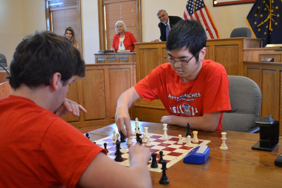 Members of the Martinsville Artesian Chess Club play a game of bullet chess at city hall. Mayor Kenny Costin read a proclamation Monday declaring the week of May 9-13, 2022, as "Martinsville Artesian Chess Club Week."