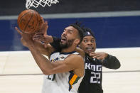 Sacramento Kings center Richaun Holmes (22) fouls Utah Jazz center Rudy Gobert, left, in the second half during an NBA basketball game Saturday, April 10, 2021, in Salt Lake City. (AP Photo/Rick Bowmer)