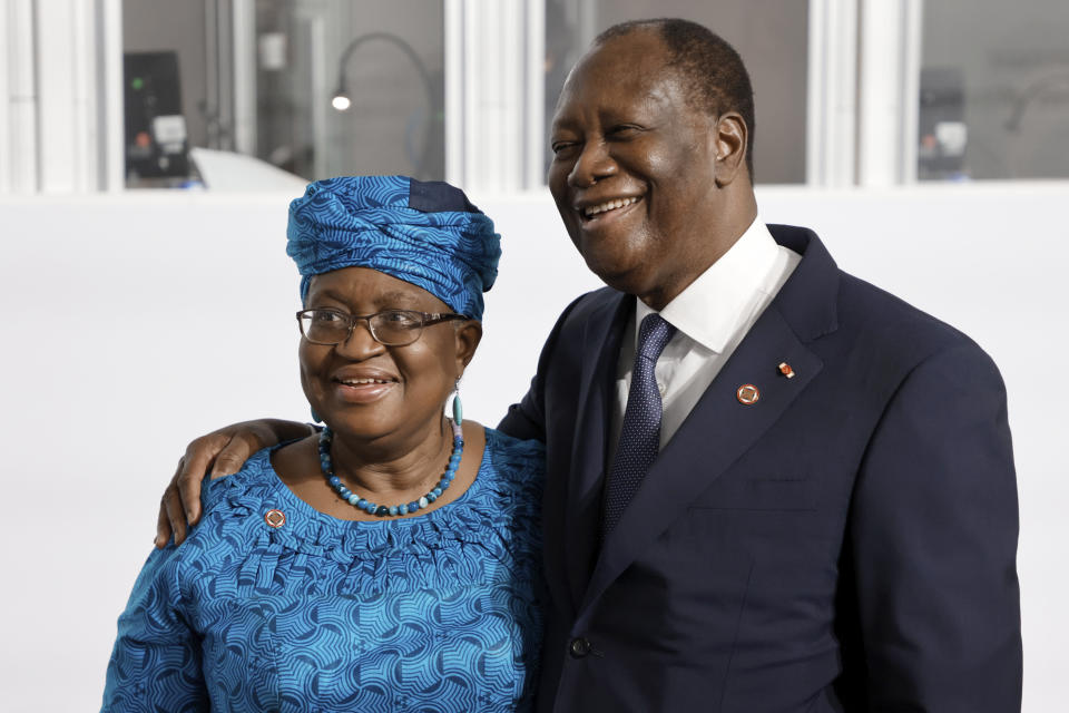 The Director-General of the World Trade Organization Ngozi Okonjo-Iweala, left, poses with Ivory Coast President Alassane Ouattara before the opening session at the Summit on the Financing of African Economies Tuesday, May 18, 2021 in Paris. More than twenty heads of state and government from Africa are holding talks in Paris with heads of international organizations on how to revive the economy of the continent, deeply impacted by the consequences of the COVID-19 pandemic. (Photo by Ludovic Marin, Pool via AP)