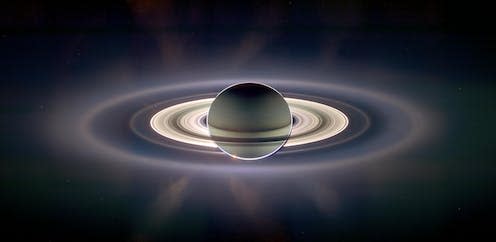 <span class="caption">A colour-exaggerated view of Saturn backlit by the sun.</span> <span class="attribution"><a class="link " href="https://solarsystem.nasa.gov/resources/13315/in-saturns-shadow-color-exaggerated-view/" rel="nofollow noopener" target="_blank" data-ylk="slk:NASA/JPL/Space Science Institute;elm:context_link;itc:0;sec:content-canvas">NASA/JPL/Space Science Institute</a></span>