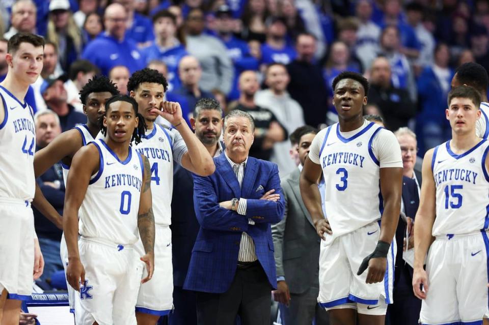Kentucky coach John Calipari and his team watch Antonio Reeves take free throws after a technical foul was called on Arkansas coach Eric Musselman during Saturday’s game at Rupp Arena.