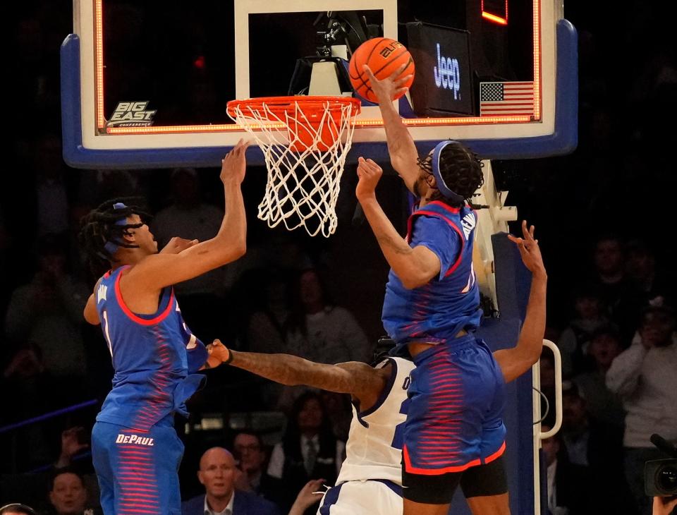 DePaul Blue Demons center Nick Ongenda (14) blocks the last second shot by Seton Hall Pirates guard Femi Odukale (21) to win the game at Madison Square Garden.